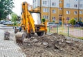Construction of a new road. excavator prepares the surface Royalty Free Stock Photo