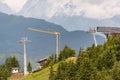 Construction of a new ski lift. Upper ski lift station. Yellow crane at the construction site Royalty Free Stock Photo