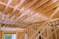 During construction of new unfinished residential home, wood framing supports a beam