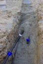 Construction of a new water supply system, pipe in trench Royalty Free Stock Photo