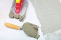 Construction notched trowel with mortar for tiles work