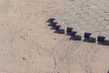 Bricklayer places concrete paving stone blocks for building up a Sidewalk pavement Royalty Free Stock Photo