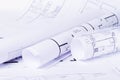 Construction plan. Scheme drawing rolled up in a roll. Home renovation planning. Royalty Free Stock Photo