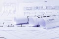 Construction plan. Scheme drawing rolled up in a roll. Home renovation planning Royalty Free Stock Photo