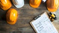 Construction Planning and Safety Gear: Hard Hats,Blueprint and Model Vehicle on Work Surface for Building Projects Royalty Free Stock Photo
