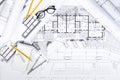 Construction plans with drawing Tools on blueprints