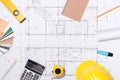 Construction plans with helmet and drawing tools on blueprints Royalty Free Stock Photo
