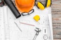 Construction plans with helmet and drawing tools on blueprints . Royalty Free Stock Photo