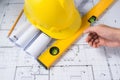 Construction plans with helmet and drawing tools on blueprints Royalty Free Stock Photo