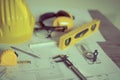 Construction plans with helmet and drawing tools on blueprints . Royalty Free Stock Photo