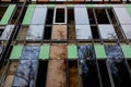 Construction process, glazing of facade of a residential building, hotel or other commercial property. Empty and glazed windows Royalty Free Stock Photo