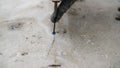 Construction worker demolishing concrete floor with rotary hammer drill Royalty Free Stock Photo
