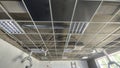 Construction progress on a modern ceiling showing lighting and ventilation systems in an empty room Royalty Free Stock Photo
