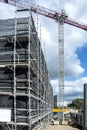 Construction progress on new building site with tower crane and blue sky. Gosford, Australia. March 7, 2021. 56-58 Beane St. Part Royalty Free Stock Photo