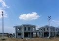 Construction progress in a real estate property project site, people are building the precast house on the brown land Royalty Free Stock Photo