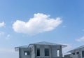 Construction progress in a real estate property project site, people are building the precast house, working in a hot day Royalty Free Stock Photo