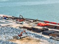 Construction progress on shipping port terminal through land reclamation. Global trade development, infrastructure engineering, Royalty Free Stock Photo