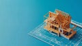 construction project, house under construction on blueprint, blue background with copy space Royalty Free Stock Photo
