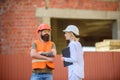 Construction project inspecting. Safety inspector concept. Construction site safety inspection. Discuss progress project Royalty Free Stock Photo