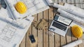 Construction project planning tools including blueprints laptop hard hats and gloves on wood surface Royalty Free Stock Photo