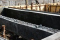 Construction of steel beams and plastering for building foundations. Royalty Free Stock Photo