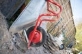 Construction and renovation: Close up of a wheelbarrow on a construction site Royalty Free Stock Photo