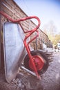 Construction and renovation: Close up of a wheelbarrow on a construction site Royalty Free Stock Photo