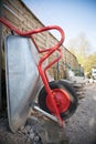 Construction and renovation: Close up of a wheelbarrow on a construction site Royalty Free Stock Photo