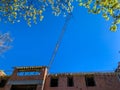 construction of a residential brick house.  facade.  tower crane. Royalty Free Stock Photo