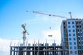 Construction of residential buildings and high-rise cranes. Building site Royalty Free Stock Photo
