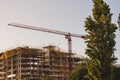 New flats, residential high-rise multistory house building. Construction crane. Royalty Free Stock Photo