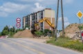 Construction of a road in the city - an excavator sifts stones from the excavated ground. Royalty Free Stock Photo