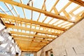 Construction of the roof frame of a small house. The wooden structure is ready for roofing work. Inside view. Unfinished object