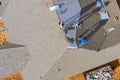 Construction roofing worker on roof house installed new shingles Royalty Free Stock Photo