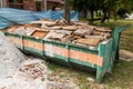 Construction rubbish bin with loads at construction site Royalty Free Stock Photo