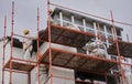 Construction scaffolding on the front of the building.