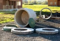 construction of the sewage system in the cottage of concrete rings for septic tanks