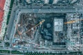 Construction site aerial top view from drone. Tower cranes and industrial machinery, housing development Royalty Free Stock Photo