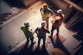 At the construction site, an architect engineer is engaged discussion about the project plan, exchanging ideas with colleagues. Royalty Free Stock Photo