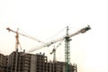 Construction site background. Hoisting cranes and new multi-storey buildings. Copy space for text. ndustrial background.