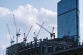 Construction site banner background. Construction industry and business concept. Cranes on a blue background. Royalty Free Stock Photo