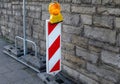 Construction site barrier warning sign blinking signal light Royalty Free Stock Photo