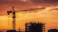 Big crane and building construction against beautiful dusky sky Royalty Free Stock Photo