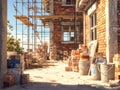 Construction site of a brick building under renovation with scaffolding and building materials Royalty Free Stock Photo