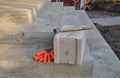 Construction Site: Bricklaying Tools & Protective Gear on Concrete Steps for Building Project Royalty Free Stock Photo