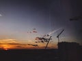 Construction site, building and crane silhouette in amazing sunset, view of city and sky. Blue and yellow sky with clouds, Royalty Free Stock Photo