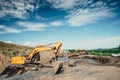 construction site building details with excavators loading dumper trucks, bulldozer, scoop working and engineers