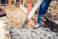 construction site - building sidewalks and pouring cement on reinforcement bars