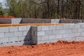 On the construction site, cement blocks are laid for the walls that will support the foundation of the house. Royalty Free Stock Photo