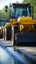 Construction site close-up: Yellow roller compacts black asphalt, transforming country road.